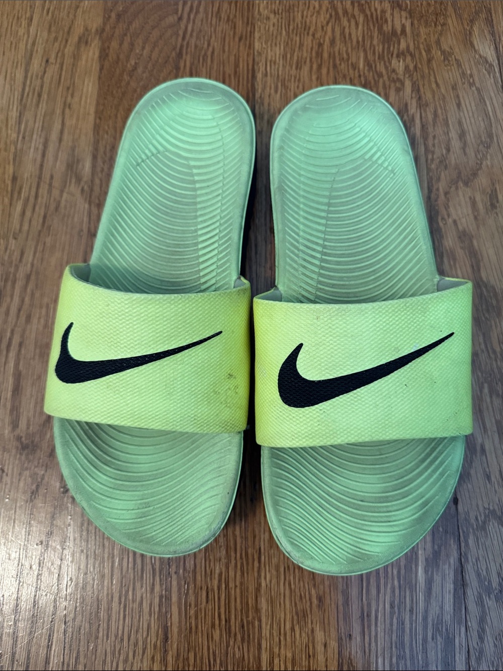 Nike Light Green Slide Sandals with Black Swoosh